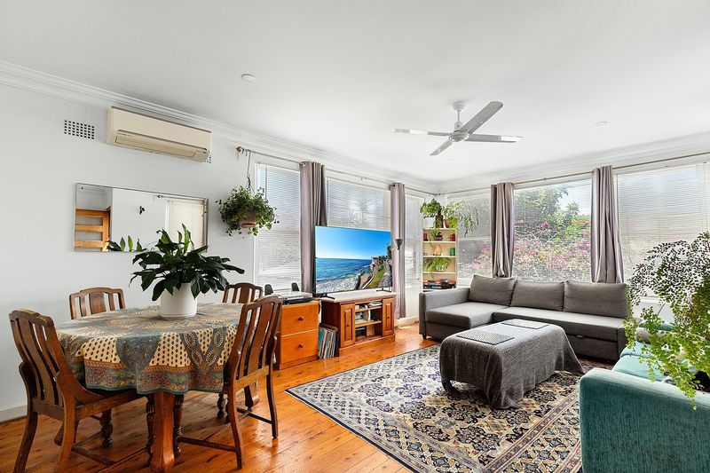 Dining and living room with timber floors