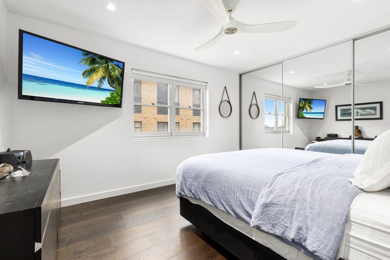 Bedroom with a mirrored wardrobe