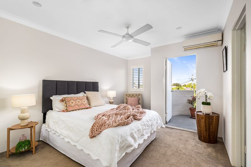 Bedroom with a door to the balcony