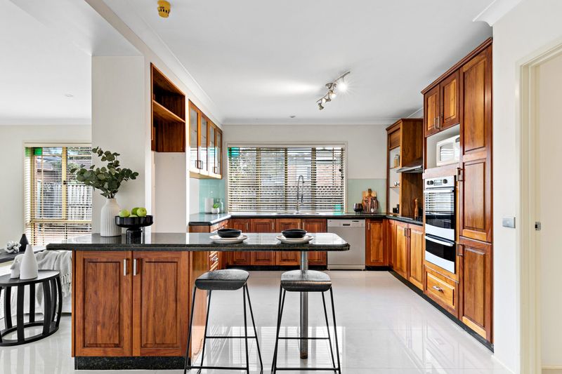 Kitchen with timber cabinets and an island bench