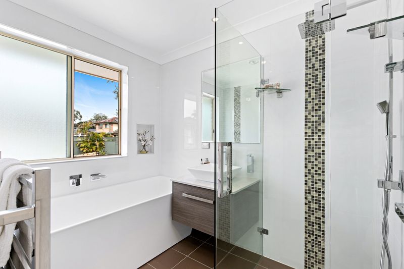Bathroom with a glass shower and bath
